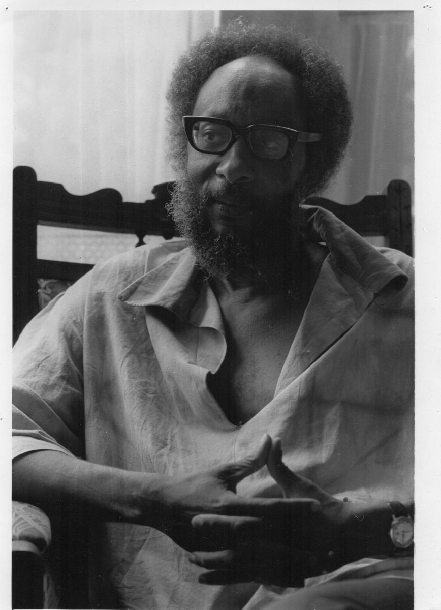 Kamau Circa 1983. Photo credited to the Cambridge photographer Mark Lumley, and was used by New Beacon Books on the back cover of History of the Voice (1984).  Unable to find exact date, and Kamau has no recollection of visiting Cambridge at that time.  