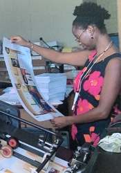 ArtsEtc co-editor Deane examines the first issue of ArtsEtc hot off the presses at Calton Printing, Christ Church, Barbados in 2003.