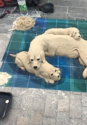 Sand art "puppy love" in China, 2019.