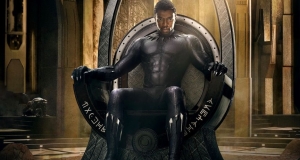 Chadwick Boseman as Black Panther (Marvel Studios, 2017), on the throne in Wakanda.