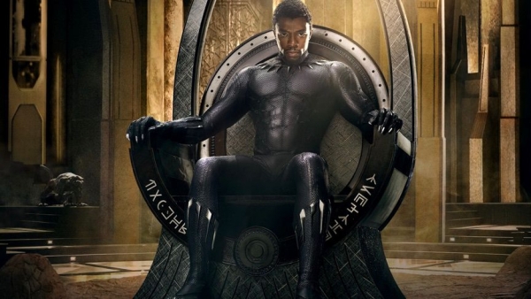 Chadwick Boseman as Black Panther (Marvel Studios, 2017), on the throne in Wakanda.