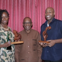 ArtsEtc Editor Linda M. Deane with top 2016 Frank Collymore Literary Award winner Kerry Belgrave.  Between them is then Governor of the Central Bank of Barbados DeLisle Worrell, January 2017.