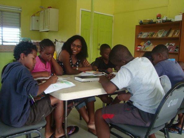 Kids in Action getting down to work at a community centre in Barbados.