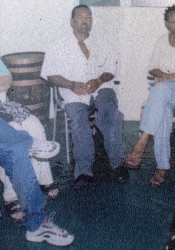 ArtsEtc planning meeting, Queen's Park Gallery in 2002: (L-R) Mark Selman, Orin Boyce, Carolle Bourne, Kingsley Roberts, Linda Deane, Robert Sandiford, Dolores Sandiford (partially hidden) and Esther Jones.