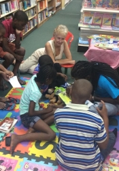 Writers Sarah Venable and DJ Simmons with young storytellers at Days Books, Bridgetown for the launch of ArtsEtc's Read2Me!-Write4Me! programme in 2015