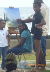 ArtsEtc babies: (L-R) Aeryn Sandiford, Adanna Alleyne and Izora Devonish (daughters of Robert Sandiford, Nailah Imoja and Linda Deane, respectively) with plein air artist Rodney Ifill at Green Readings, Hastings Rocks, Christ Church in 2013 