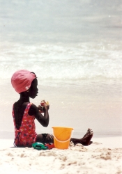 Oisitns • girl on beach w. fruit